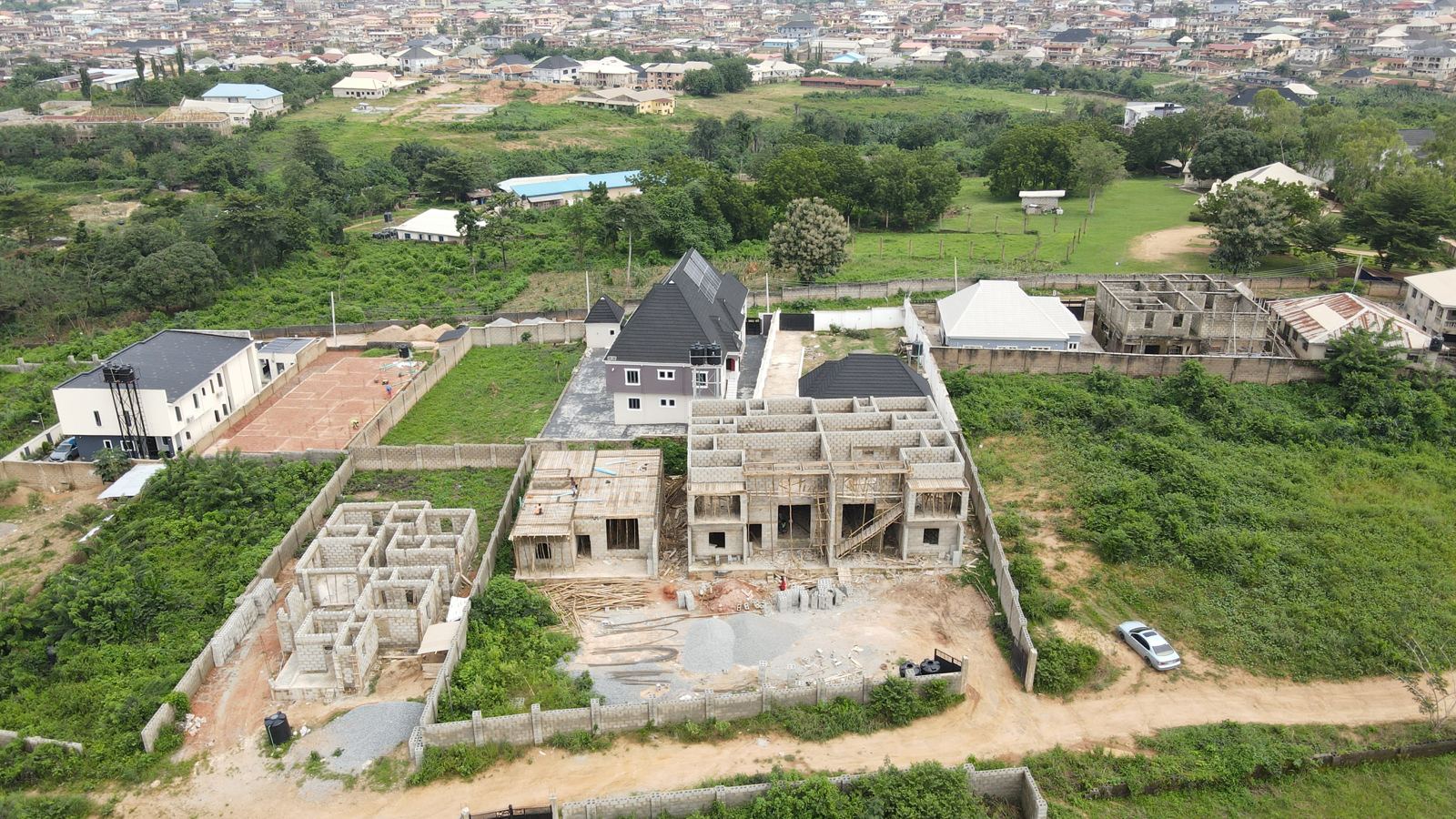 Aerial view of the Eden site at weeks 17 to 19: first-floor walls up on the two-storey block, with the ground-floor block beside it